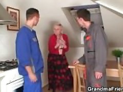 Several repairmen burgeoning gaffer grandma from both ends